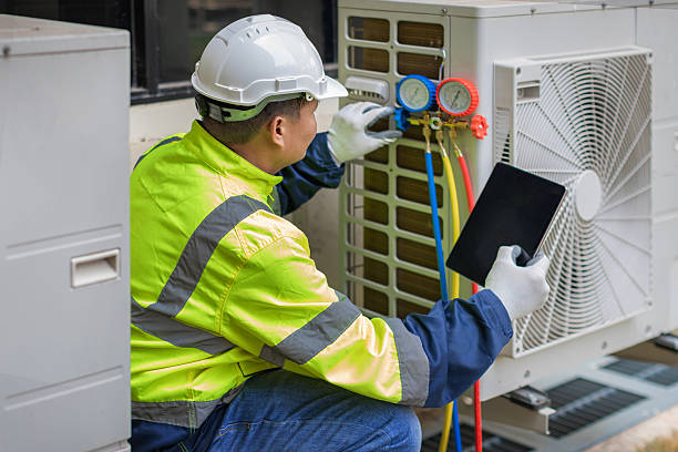 Professional Air Duct Cleaning technician working in Henry, IL